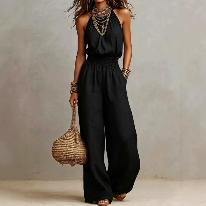 Elegant women's sleeveless halter neck wide leg jumpsuit, perfect for resort wear or a chic vacation.