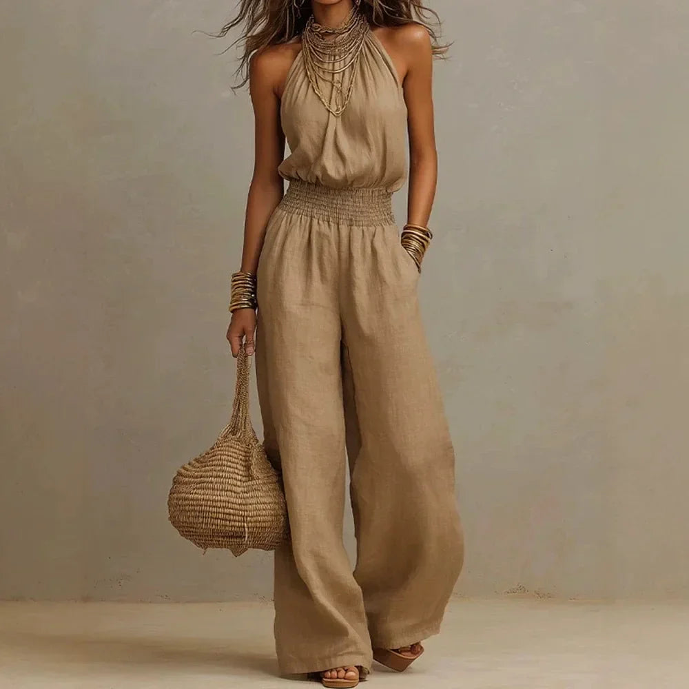 Casual one-piece women's halter neck wide leg jumpsuit with pockets, ideal for comfortable summer fashion.