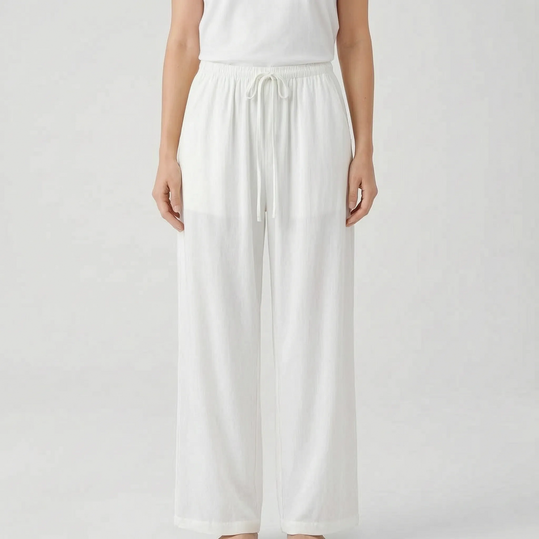 Women's solid wide-leg summer pants. Adjustable waist & relaxed fit perfect for travel and casual elegance.