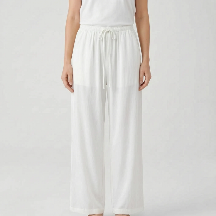 Women's solid wide-leg summer pants. Adjustable waist & relaxed fit perfect for travel and casual elegance.