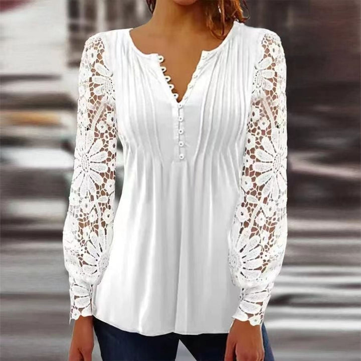 Women's Henley blouse with delicate lace long sleeves and button front. Effortless style.