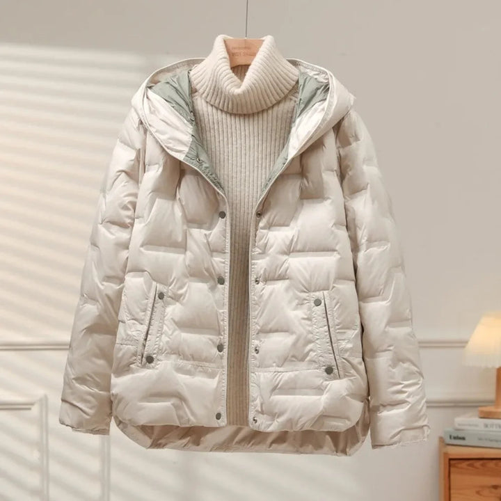 Women's Heritage Puffer Jacket in black, offering effortless warmth, style, and a quilted design with snap closure.