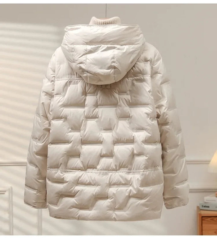 Stylish women's heritage puffer jacket, perfect for winter layering, providing warmth and comfort with a sleek design.