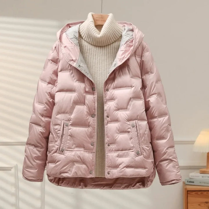 Classic women's heritage puffer jacket, a warm quilted outerwear piece with a durable snap closure for winter style.