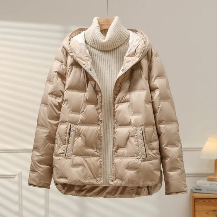 Cozy women's quilted puffer jacket, ideal for cold weather, offering warmth, comfort, and a fashionable layering option.