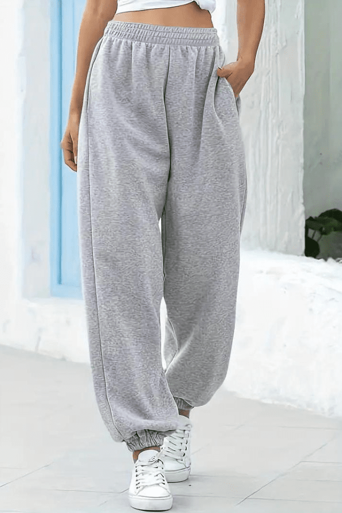 Women's high-rise joggers with elastic waistband, designed for daily comfort & relaxed fit.