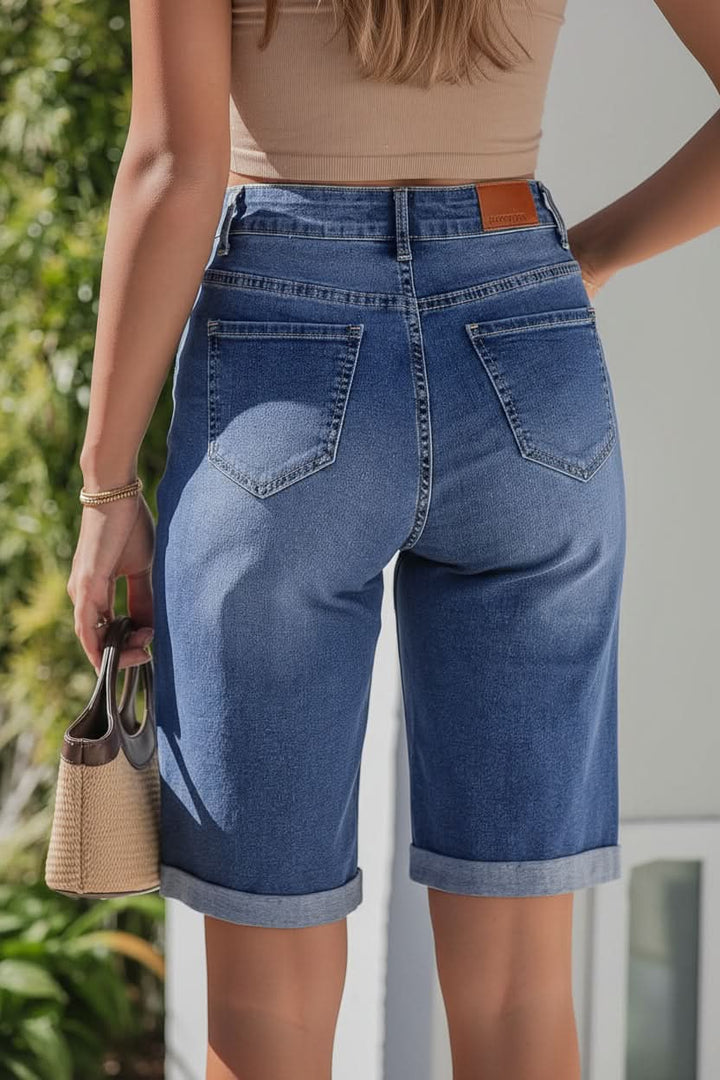 Stylish high-rise Bermuda shorts for women, offering a comfortable, relaxed fit.