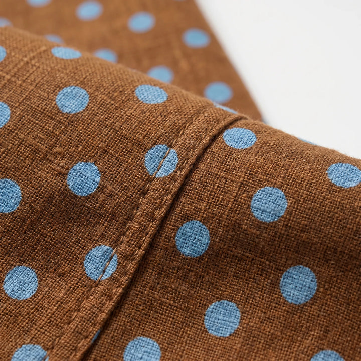 Fashionable women's polka dot barrel-leg pants with a high-rise waist and adjustable hem for versatile styling.