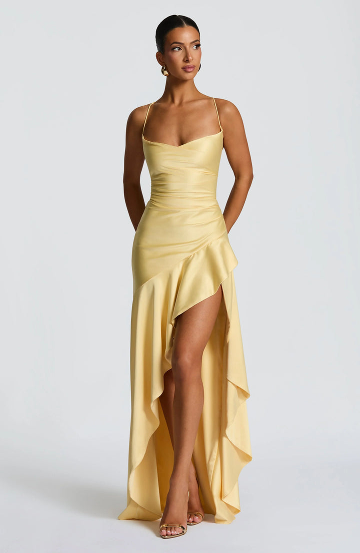 Sleek open-back maxi dress for women, suitable as a wedding guest or evening gown.