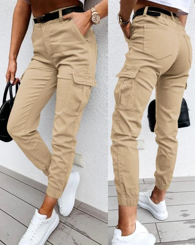 A woman wearing chic high waist cargo jogger pants, showcasing comfort & utility for active lifestyles.
