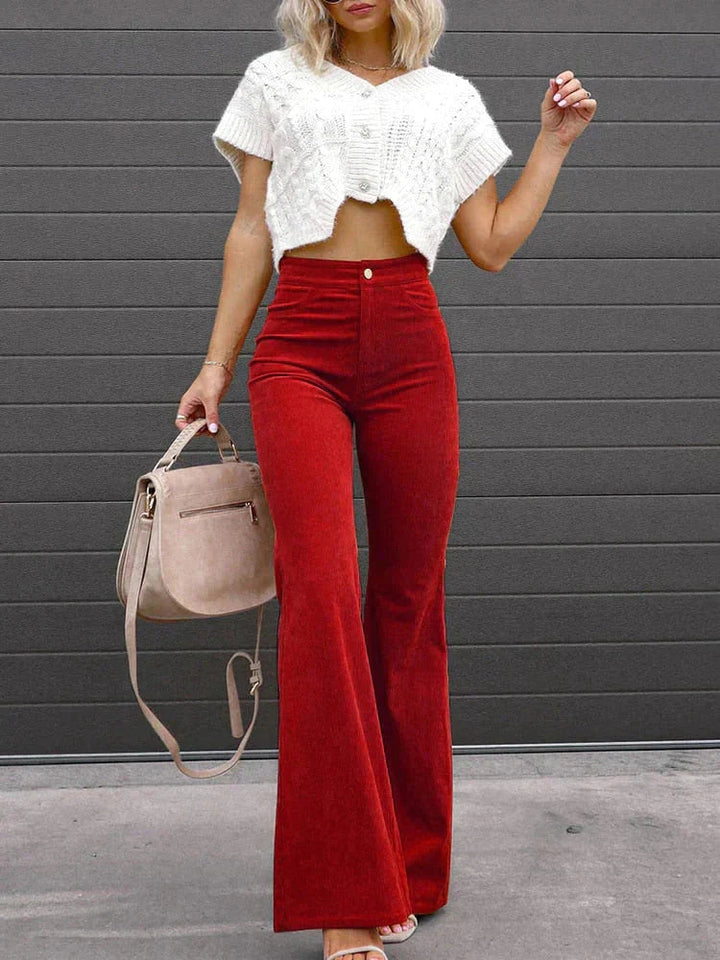 Versatile women's black flare pants, high waist with pockets, great for casual outings or work.