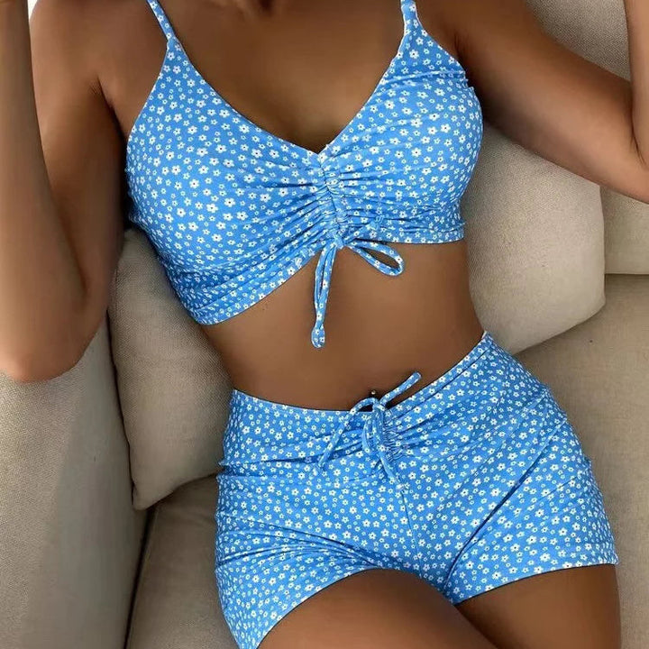 Stylish floral print high-waisted bikini set for women, supportive padded top, beach vacation swimwear.