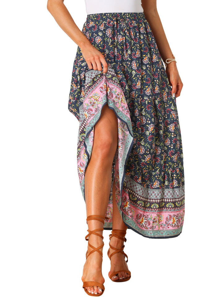 Women's flowing high waist maxi skirt with a stunning print and graceful side slit.