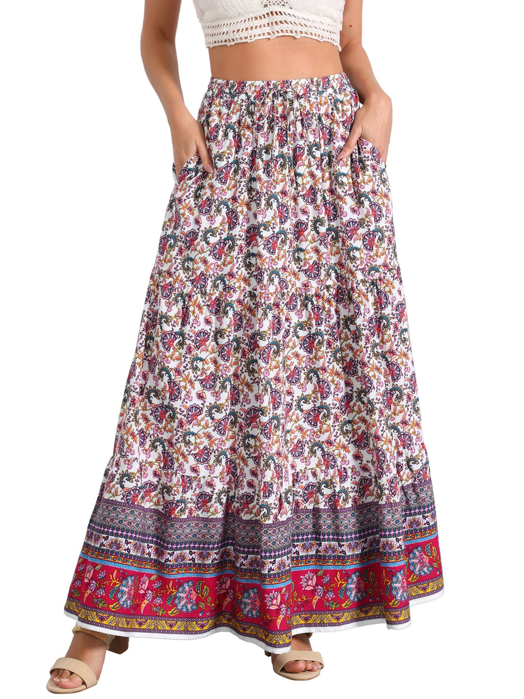 Women's flowing maxi skirt, high waist, vibrant print, and a fashionable side slit.