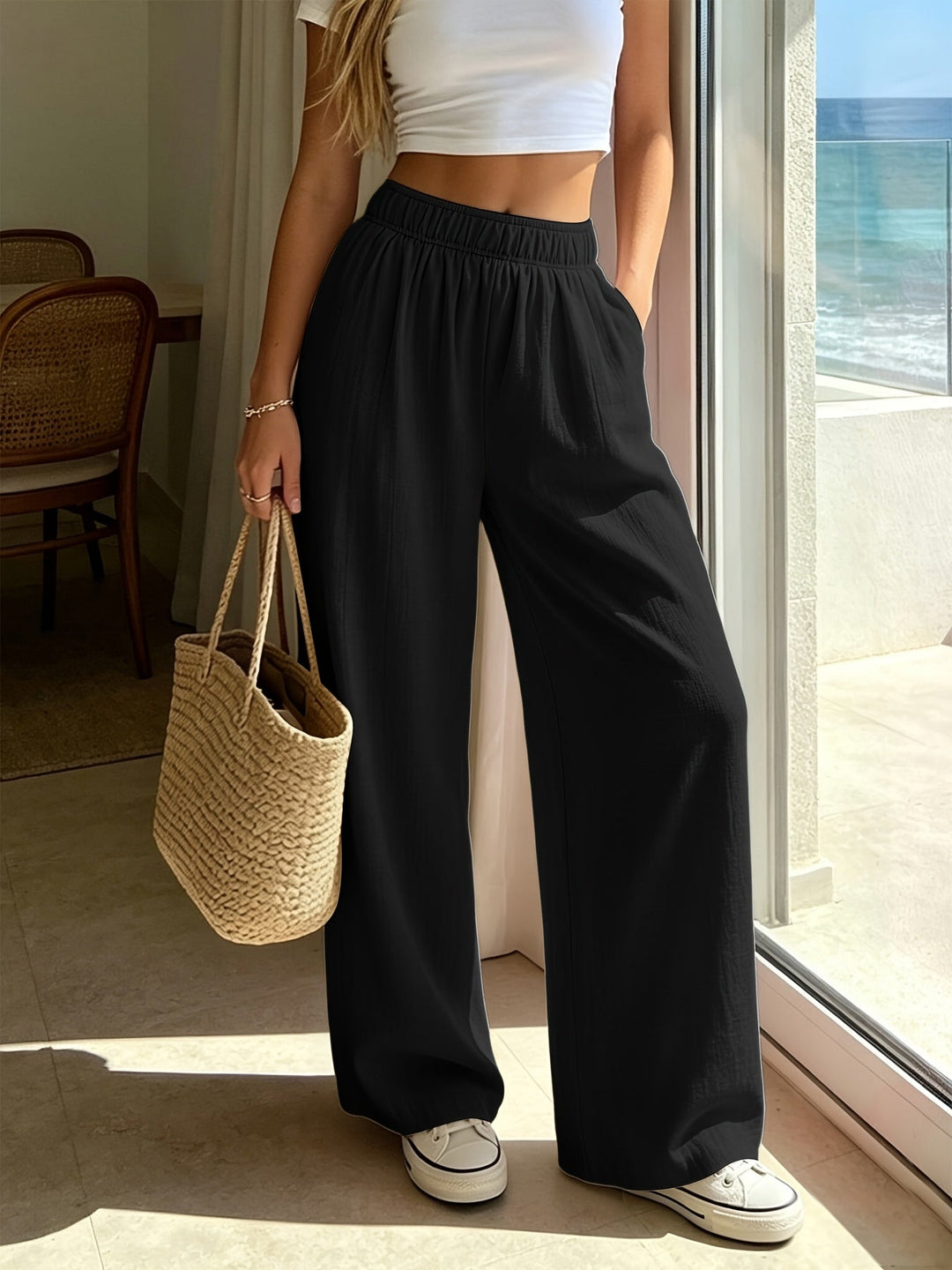 Comfortable women's relaxed fit wide leg pants, high waist with drawstring, ideal for vacation fashion.
