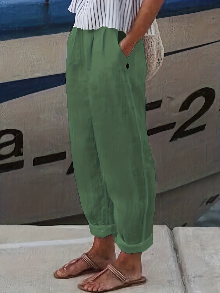 Effortless high waist women's relaxed pants with a roll hem, perfect for beachwear & warm weather style.