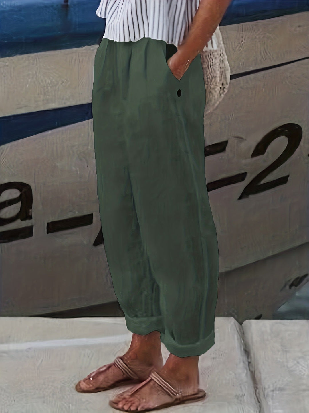 Soft, flowy women's high waist pants, offering a relaxed fit, comfortable elastic waist, and stylish roll hem.