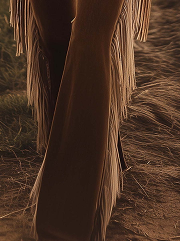 Statement women's high waist jeans with dramatic side fringe and a flattering flared leg, country chic style.