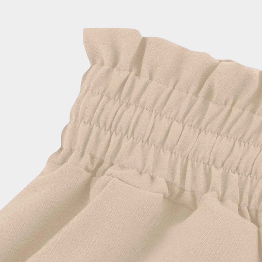 Comfortable high waist wide leg pants for women. Features drawstring, practical pockets, and an elegant flowing design.
