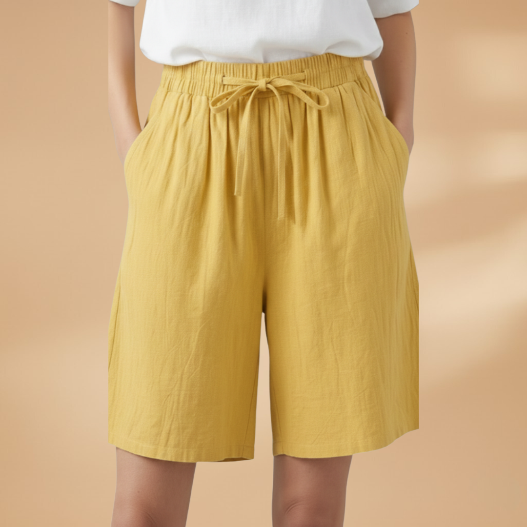 Casual women's wide leg shorts featuring a high waist and adjustable drawstring. Ideal for resort.