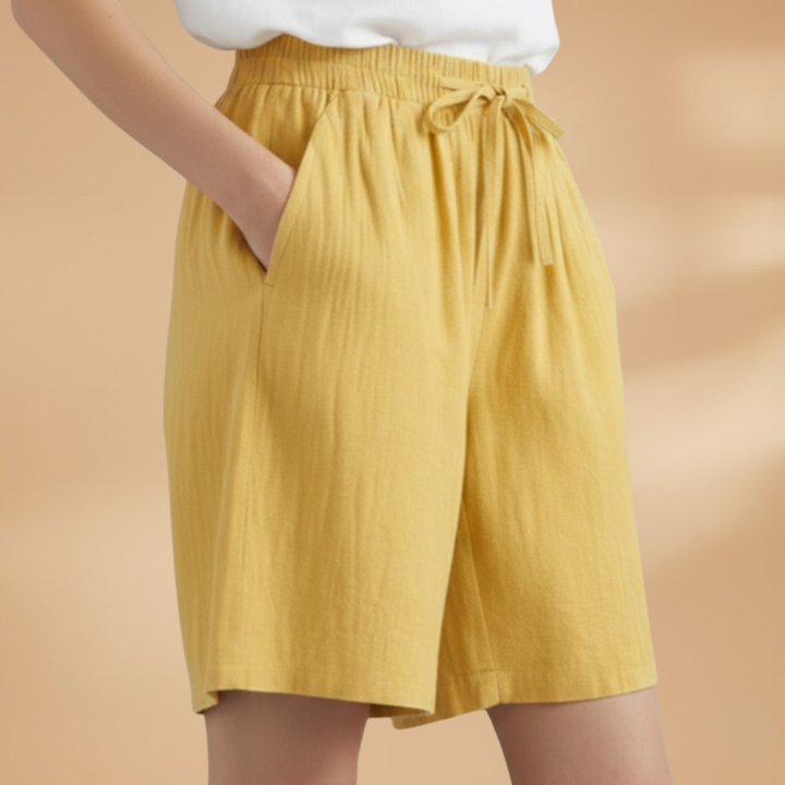 Comfortable women's summer shorts: high waist, wide leg cut, practical drawstring closure.