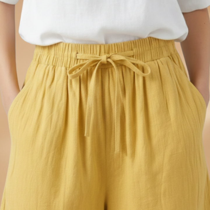 Relaxed fit women's wide leg shorts, high waist with drawstring. Great for summer fashion.