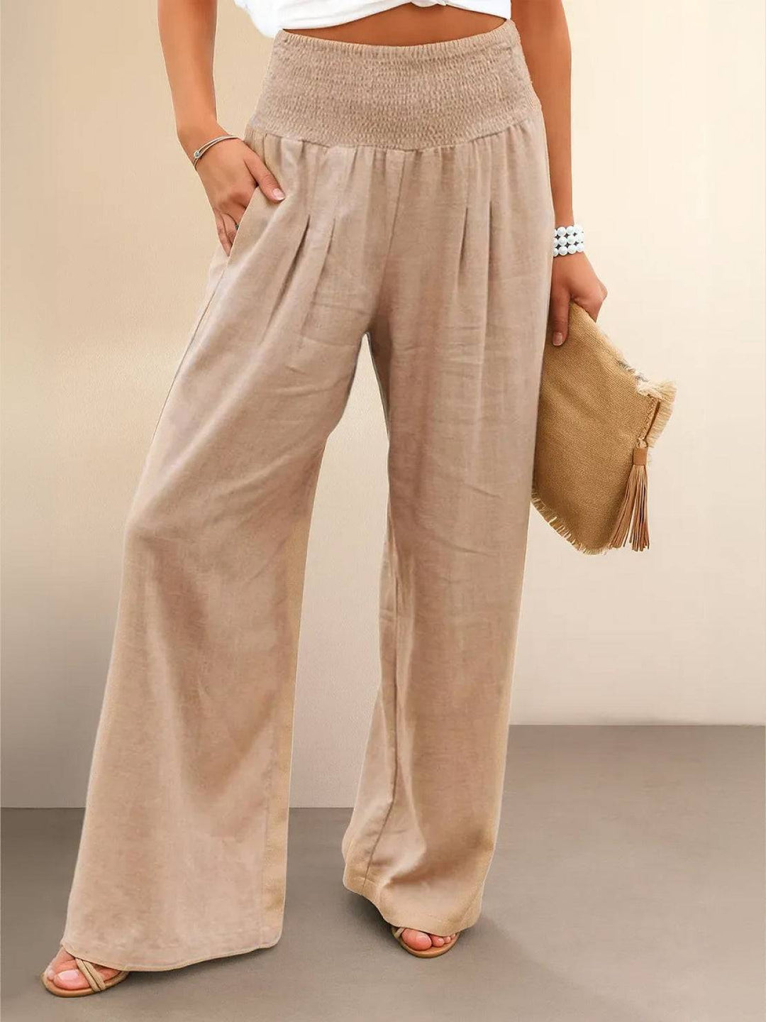 Women's high waist wide leg smocked trousers, relaxed fit for summer comfort.