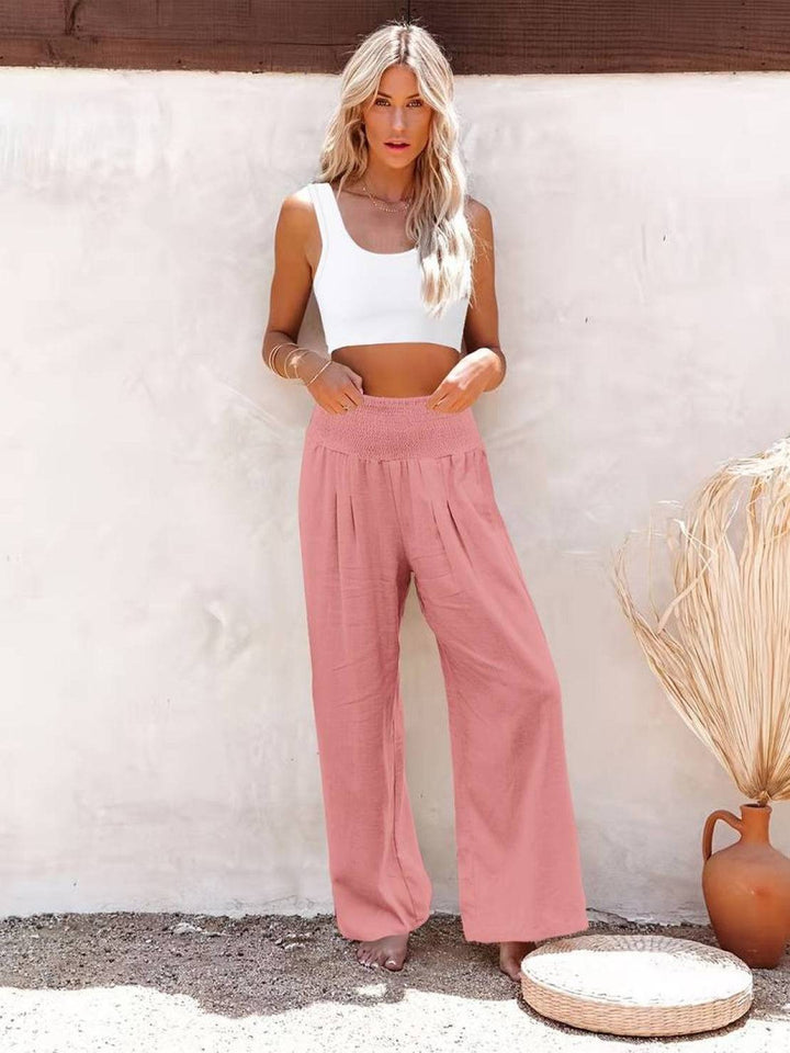 Relaxed fit high waist wide leg pants for women, smocked for comfort, perfect for warm weather.