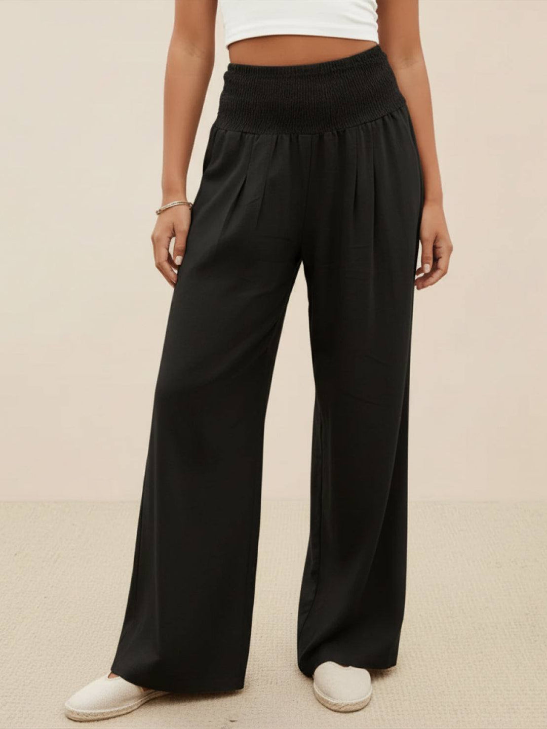 Relaxed fit smocked wide leg high waist pants for women, perfect for spring/summer comfort.
