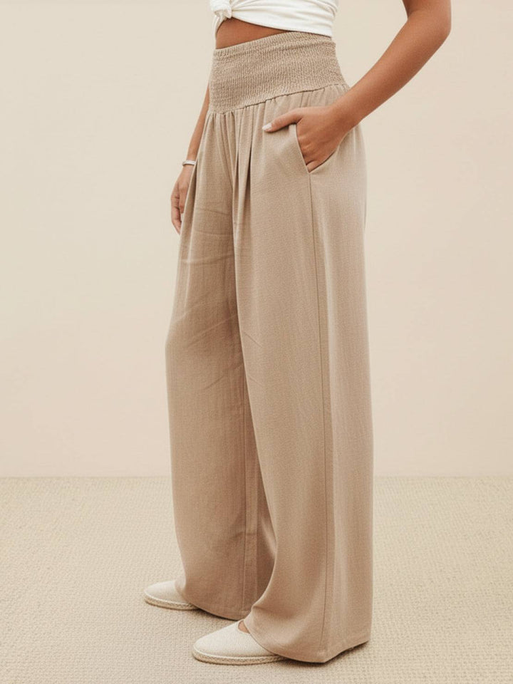 Flowy high waist wide leg pants with smocked waist, perfect for spring casual elegant style.