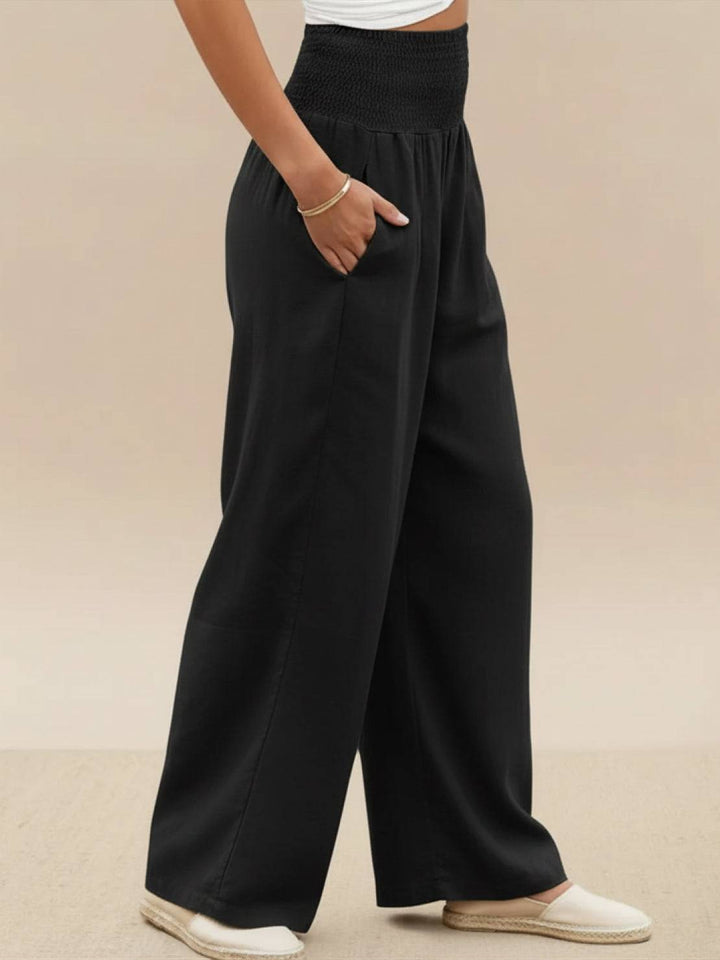 Women's pull-on high waist wide leg trousers, smocked for a comfortable and flowy fit.