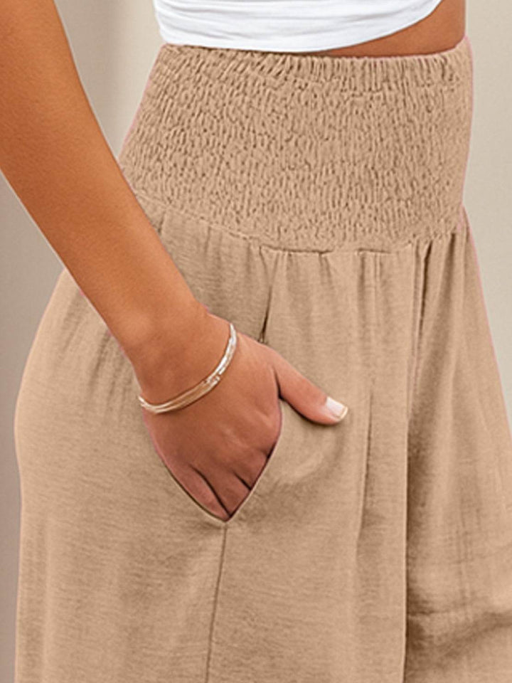 Relaxed fit smocked waist wide leg trousers, ideal for spring & summer fashion for women.