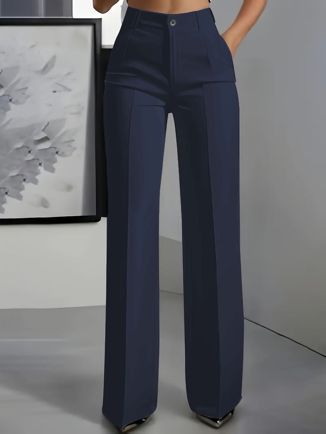 Women's high waist wide leg trousers in black, flowing fabric. Perfect for versatile casual or office wear.