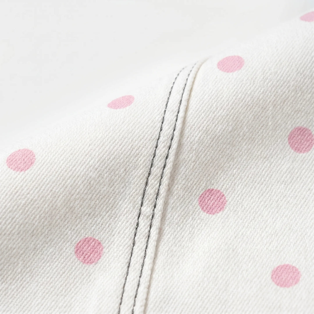 Stylish women's high-waisted barrel leg pants with a chic polka dot pattern, great for everyday wear.