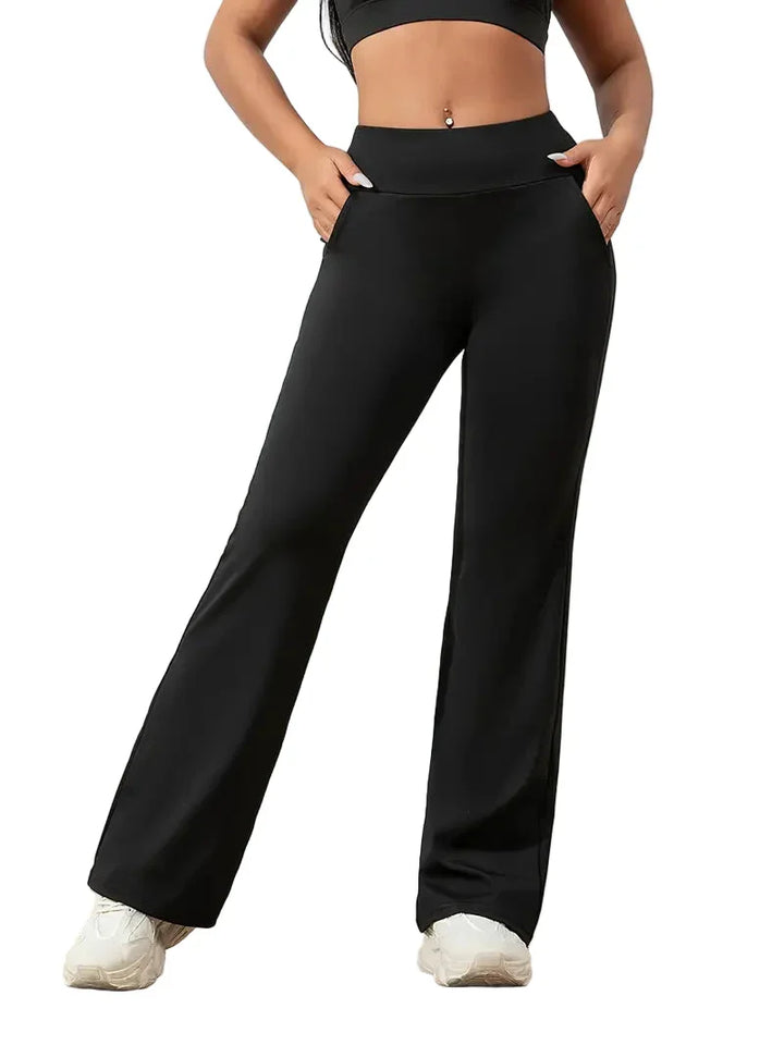 Women's high-waisted flared active pants. Perfect for yoga, workouts, or casual style. Comfortable stretch fabric.