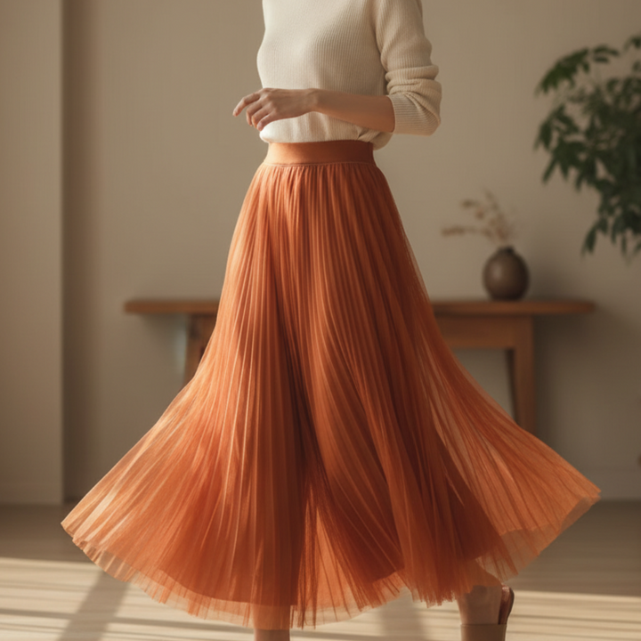 Women's high-waisted pleated A-line midi skirt, ideal for elegant and versatile fashion styling.