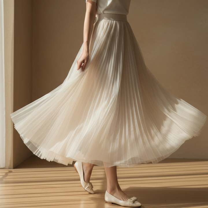 Elegant women's high-waisted pleated midi skirt, showcasing an effortless and stylish A-line silhouette.