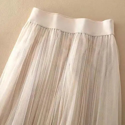 Versatile women's high-waisted pleated midi skirt, an essential for elegant casual & formal outfits.