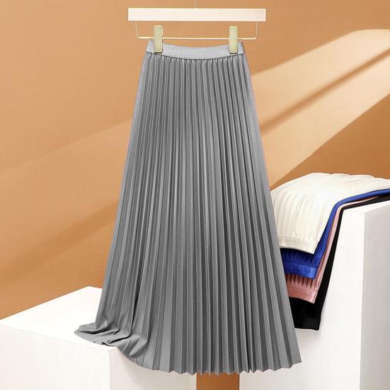 Women's high-waisted pleated maxi skirt, elegant and flowy, perfect for versatile spring and summer fashion.