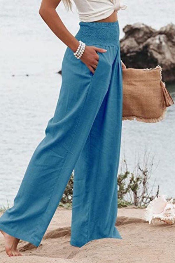 Relaxed fit women's linen pants, high-waisted with a smocked elastic waist for ultimate comfort.