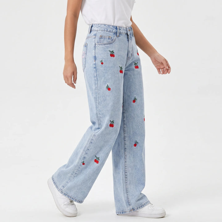 Fashionable women's wide-leg denim jeans, high-waisted with delicate cherry embroidery. Perfect for streetwear.