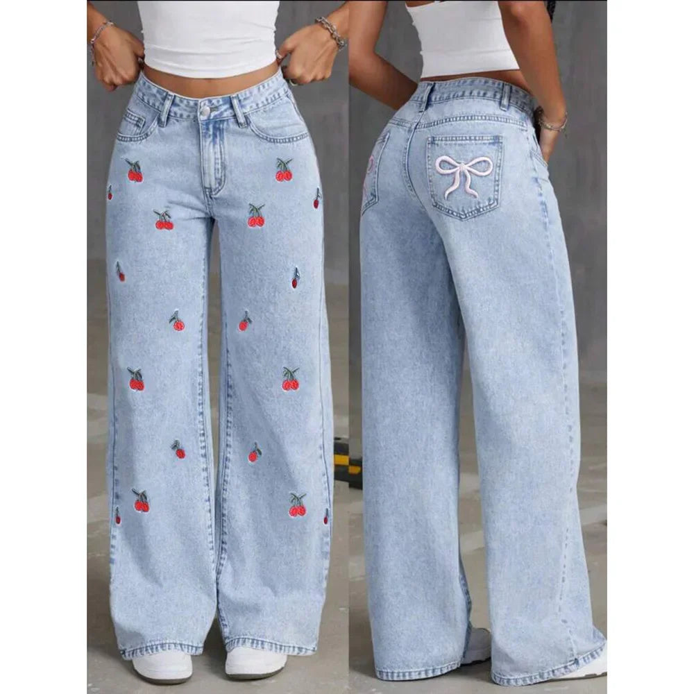 Relaxed fit high-waisted wide-leg jeans for women, in light wash denim with charming cherry embroidery.