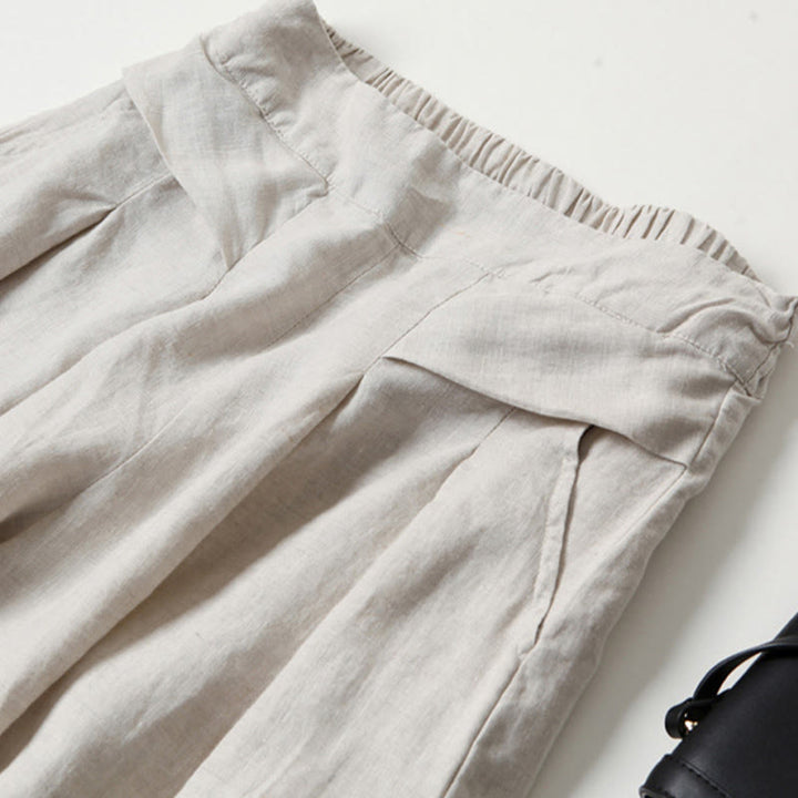 High-waisted women's trousers with a wide-leg cut, versatile for casual spring fashion.