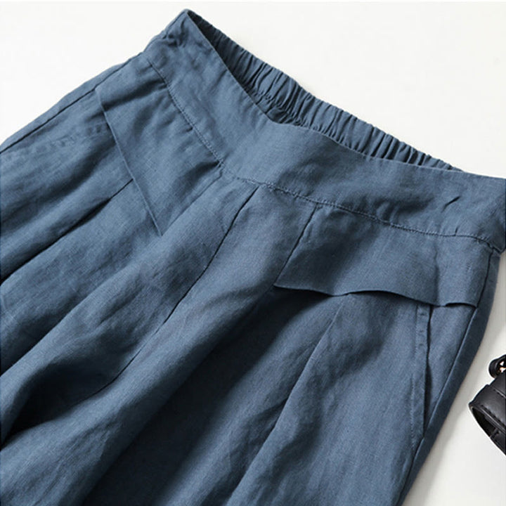 Chic high-waisted wide-leg trousers for women, designed for versatile and comfortable wear.