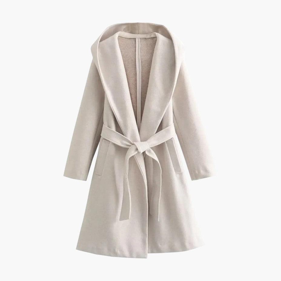 Side profile of a women's hooded belted trench coat, a stylish and weather-ready ladies' outerwear.
