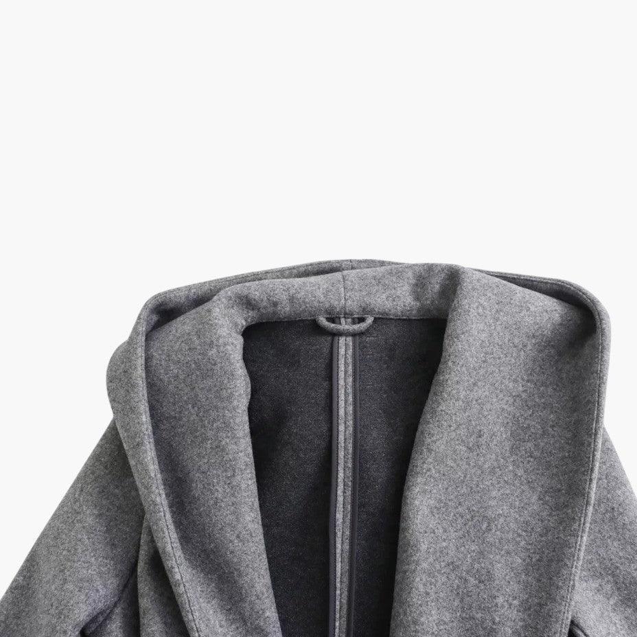 Elegant ladies' belted trench coat with a hood, offering a chic and weather-ready outerwear solution.
