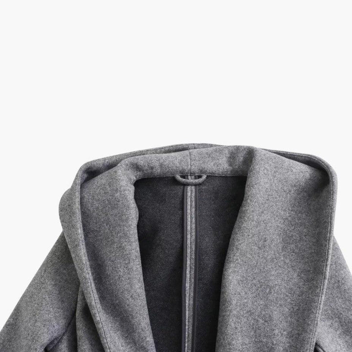 Elegant ladies' belted trench coat with a hood, offering a chic and weather-ready outerwear solution.
