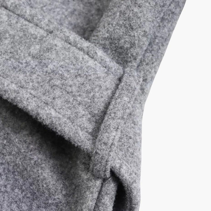 Weather-ready women's hooded trench coat, belted for style, a versatile outerwear piece for ladies.