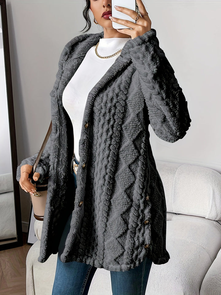 Chic women's long hooded coat with button-front. Elegant outerwear for versatile fall and winter styles.