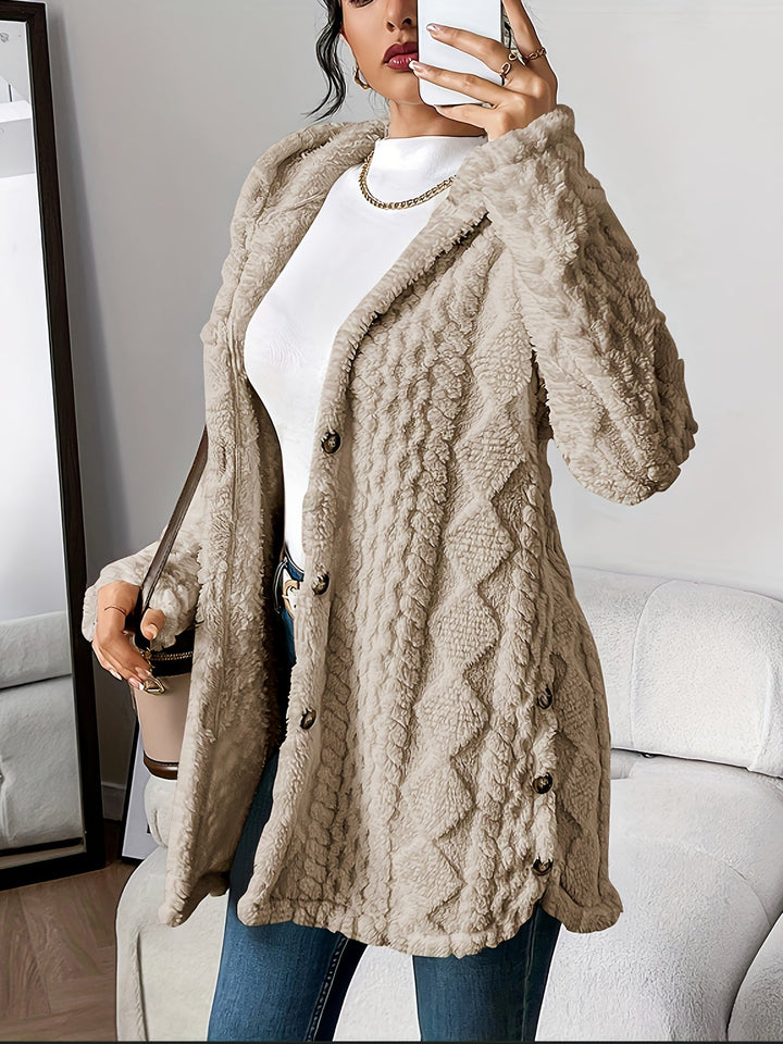 Textured women's hooded button-front long coat. Elegant fall fashion outerwear with a relaxed fit.